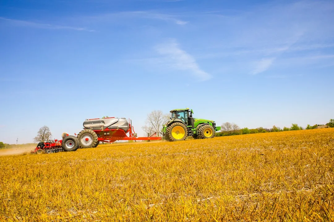 Close view of a planter row unit seeding soil in early spring
