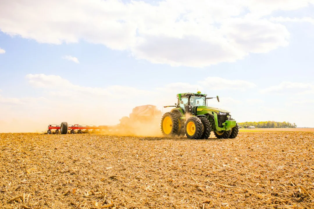 Planter working a field illustrating planting date yield response timing